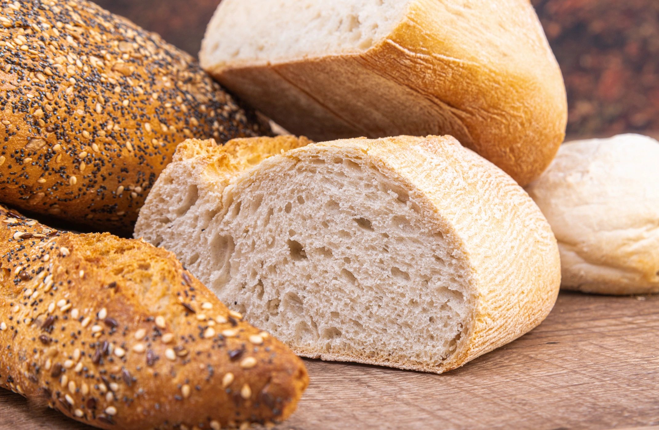 Assorted artisan bread on a wooden board