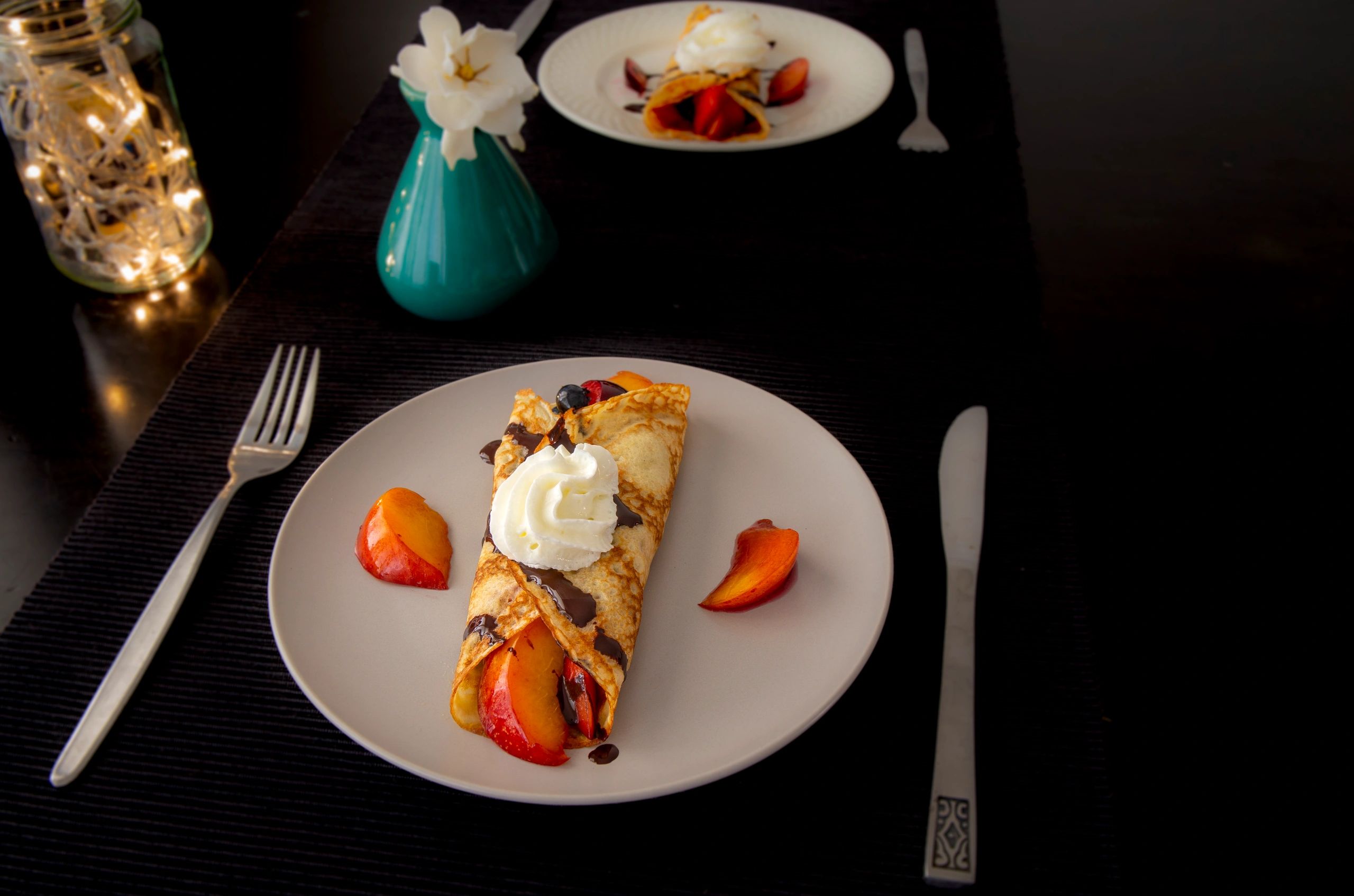 Crepes with fresh berries and chocolate sauce