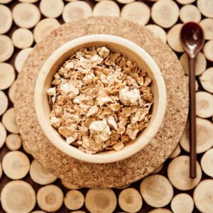 Homemade granola in a bowl on a bright neutral background