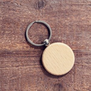 Wooden key chain on wooden background