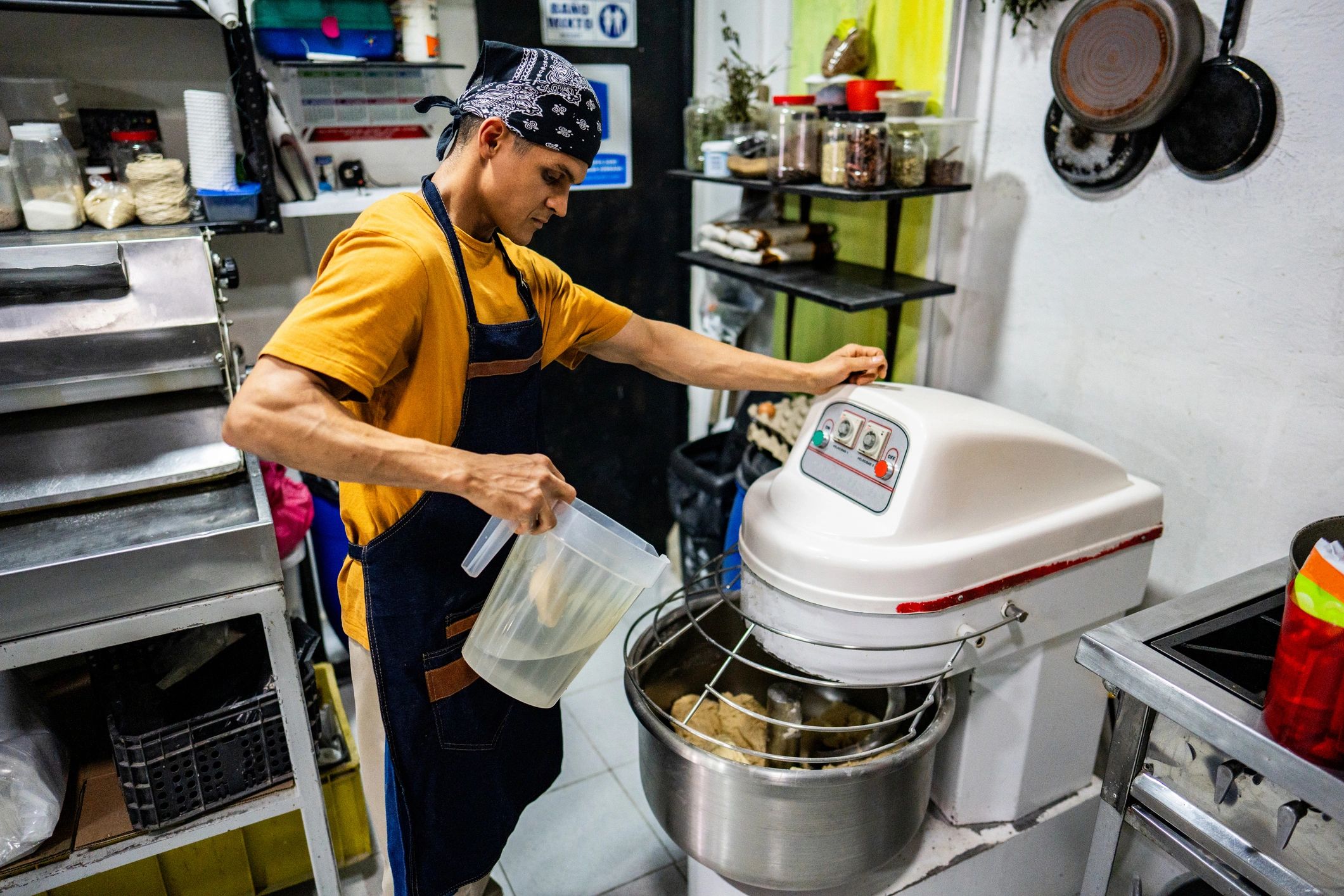Baker preparing dough in a kitchen