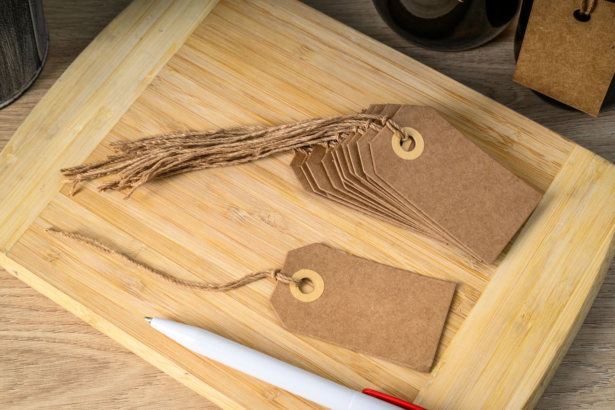 Brown card tags with a pen
